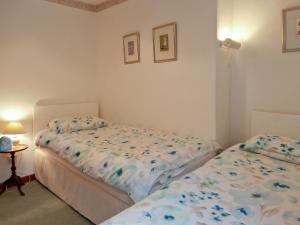 Giường trong phòng chung tại 15 Cairnbaan Cottage