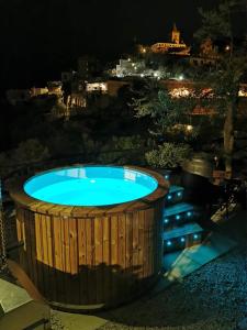 a hot tub on a patio at night at Villa Laura amazing breakfast,private outdoor hot tub, Positano experience in Positano