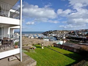 a view from the balcony of a house with a lawn at 3 Linden Court in Brixham