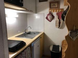 a small kitchen with a sink and a counter at Appartement Arêches-Beaufort, 2 pièces, 5 personnes - FR-1-342-144 in Beaufort
