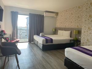 Postel nebo postele na pokoji v ubytování Embryo Hotel 