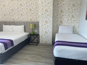 Postel nebo postele na pokoji v ubytování Embryo Hotel 