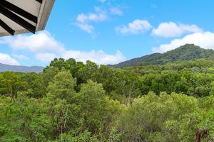 a view of a forest with mountains in the background at Vacanze A Casa - Resort Just Minutes From The CBD in Cairns North