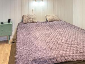 En eller flere senge i et værelse på 4 person holiday home in LINDÅS-By Traum