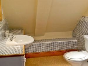a bathroom with a sink and a toilet and a tub at Myton House in Thornton Steward