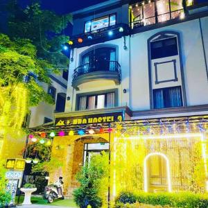 a building with a sign that reads asian matchaiden at BBQ Hostel Ha Long 2 in Ha Long