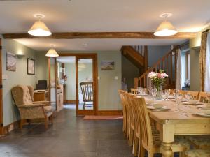 a dining room with a long table and chairs at Spekes Retreat - 18827 in Milford