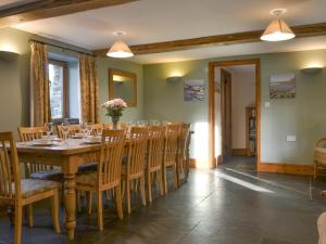 a dining room with a wooden table and chairs at Spekes Retreat - 18827 in Milford