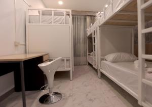 Postel nebo postele na pokoji v ubytování TarTar & Nay Hostel
