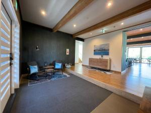 a living room with a table and chairs at Hakobune Niseko - Chalets & Apartments in Niseko
