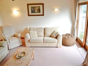 a living room with a couch and a coffee table at Torridge in Great Torrington