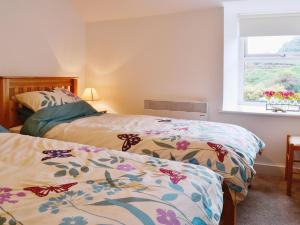 En eller flere senge i et værelse på Capel Fawnog Mawr