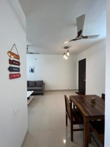 a living room with a wooden table and a couch at 2BHK luxurious beautiful flat near IIM AIIMS in Nagpur