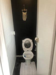 a small bathroom with a toilet in a stall at High rd hideaway in Warmsworth