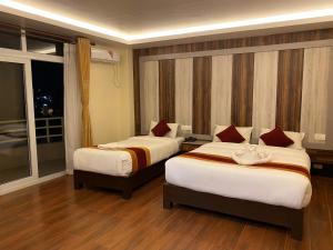 Katil atau katil-katil dalam bilik di Hotel Murano