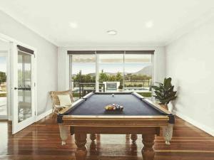 a pool table in a living room with a pool table at The York Residence in Hartley NSW - Newly Listed in Hartley