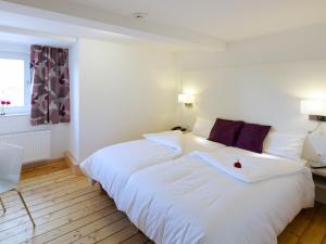 מיטה או מיטות בחדר ב-Hotel Karolinger Hof