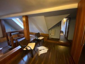an overhead view of a room with chairs and a attic at Apartments 5 in the centre of Prague in Prague