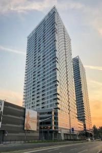 a tall building with a sign in front of it at Modern place-Top Bratislava location in Bratislava