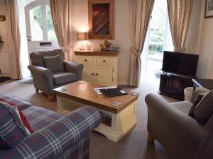 a living room with two couches and a coffee table at The Chapel in Staveley