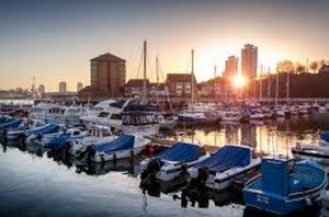 a group of boats are docked in a harbor at Fabulously Unique 3BD Home Sunderland in Sunderland