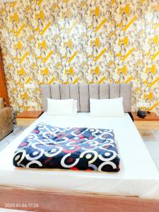 A bed or beds in a room at RBS Hotel & Restaurant 5 mint walking distance from Ram Janam Bhumi