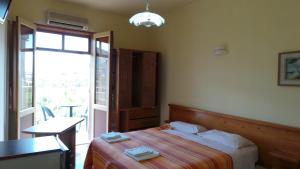 Postel nebo postele na pokoji v ubytování Hotel-Pensione 4 Stagioni