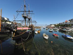 a group of boats are docked in a harbor at Green View in Churston Ferrers