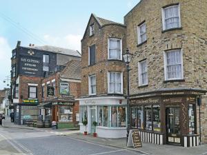 a group of buildings on a city street at Smugglers Cottage in Margate