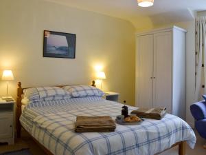 a bedroom with a bed with a tray of food on it at Popehill Farm Apartment in Johnston