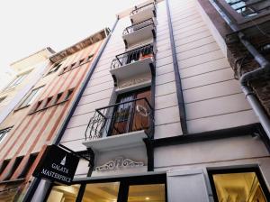 a building with a balcony on the side of it at Galata Master Hotel in Istanbul