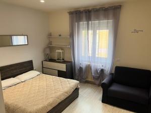 A bed or beds in a room at Le case di Lulù