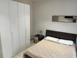 A bed or beds in a room at Le case di Lulù