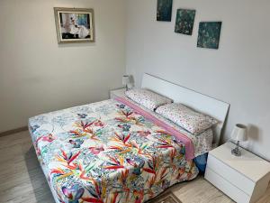 A bed or beds in a room at Le case di Lulù