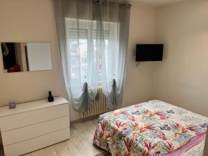 A bed or beds in a room at Le case di Lulù