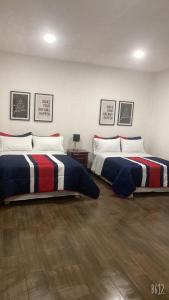 Llit o llits en una habitació de Hostal Nahui Meztli