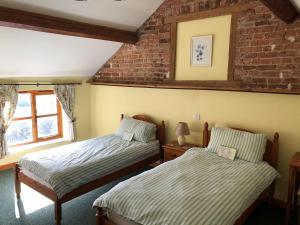 A bed or beds in a room at The Drift House