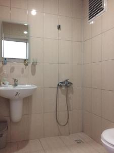 a bathroom with a shower and a sink at burak otel in Unye