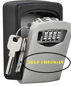 a key hooked up to a self check in machine at Appartement esprit jeune in Seynod