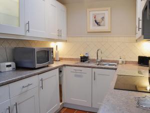 Köök või kööginurk majutusasutuses Wisteria Cottage