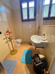 a bathroom with a sink and a toilet at B&B Camelia in Città di Castello +35 photos