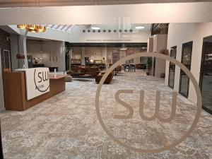 a lobby with a sun sign on the floor at Val Roya Terrasse in Nice