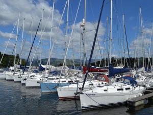 a bunch of boats docked in the water at Daisy Bank Cottage in Bowness-on-Windermere