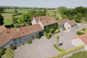 an aerial view of a house with a large driveway at Brook Cottage in Baltonsborough