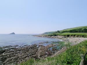 a view of the beach from the cliffs at White Dove Barn in Wembury