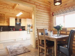 a kitchen and dining room with a table and chairs at Mayfields Retreat in Newsham