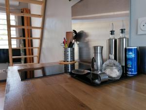 a shelf with a blender and other items on a wooden floor at Le Langka in Saint-Louis