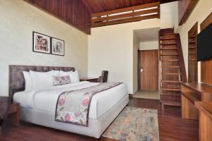 Ένα ή περισσότερα κρεβάτια σε δωμάτιο στο juSTa Grand View Resort & Spa, Manali