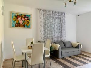 a living room with a couch and a table at Fun house in Zebanec-Selo