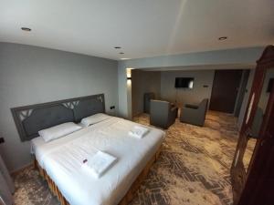 Una cama o camas en una habitación de Sur Hotel